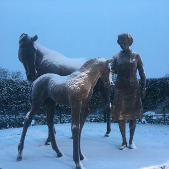 Queen in snow with horses